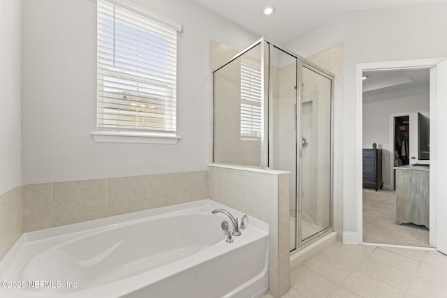 109 Redbud Ln, Yulee, FL 32097 - full bath featuring tile patterned floors, plenty of natural light, a shower stall, and a bath