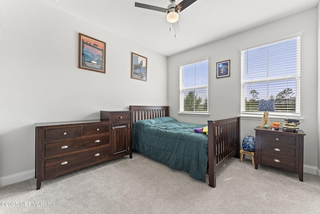 109 Redbud Ln, Yulee, FL 32097 - bedroom featuring baseboards, light carpet, and a ceiling fan