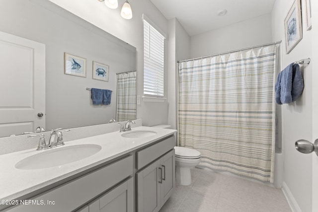 109 Redbud Ln, Yulee, FL 32097 - bathroom with double vanity, toilet, a sink, and tile patterned flooring