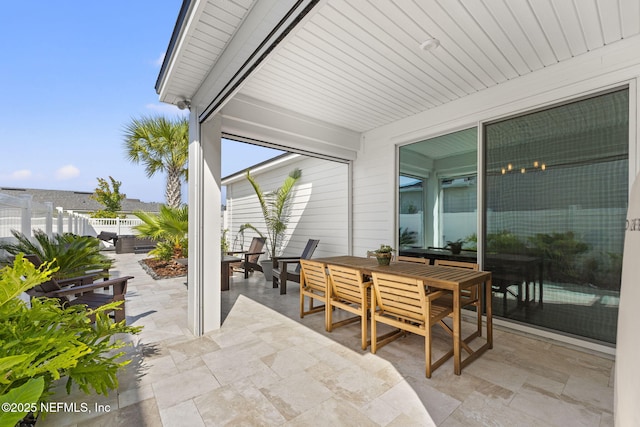 109 Redbud Ln, Yulee, FL 32097 - view of patio / terrace with outdoor dining area and fence