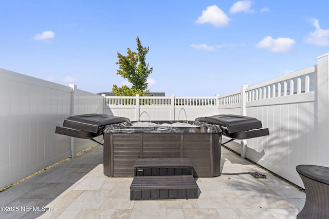 109 Redbud Ln, Yulee, FL 32097 - view of patio / terrace featuring a hot tub, a fenced backyard, and area for grilling