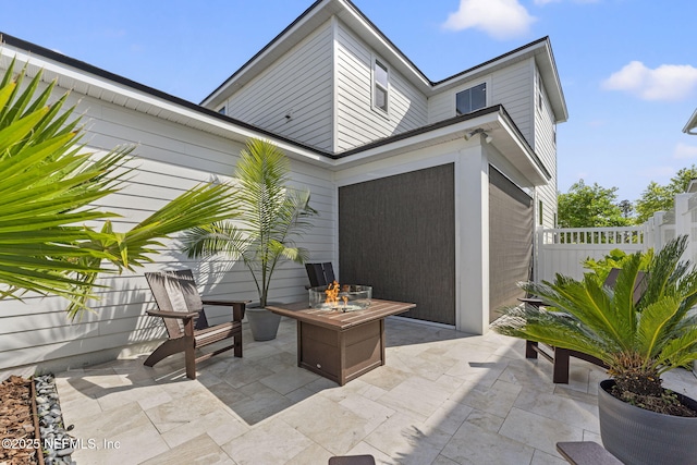 109 Redbud Ln, Yulee, FL 32097 - view of patio featuring fence and a fire pit