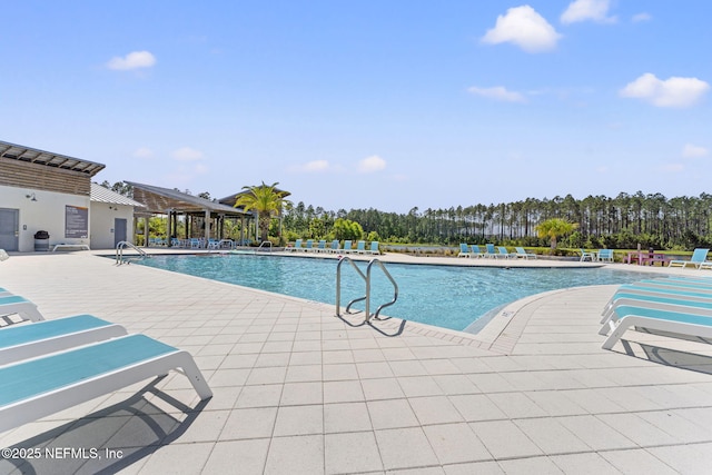 109 Redbud Ln, Yulee, FL 32097 - community pool with a patio area