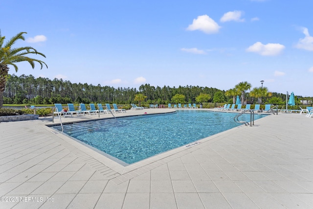 109 Redbud Ln, Yulee, FL 32097 - community pool with a patio area
