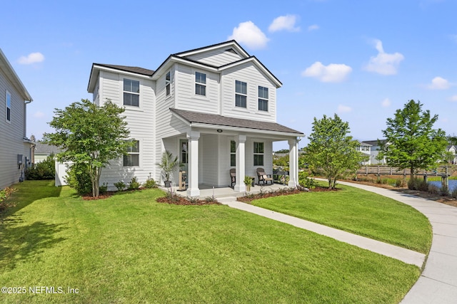 109 Redbud Ln, Yulee, FL 32097 - view of front facade with a front lawn, fence, and covered porch