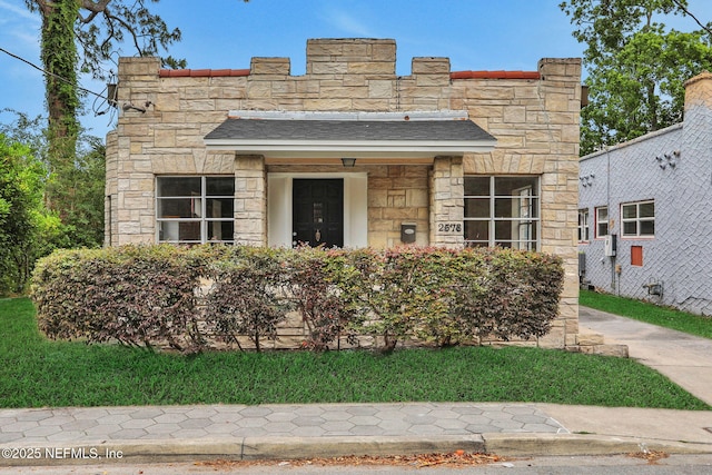 2578 Haldumar Ter, Jacksonville, FL 32204 - view of front facade with roof with shingles and stone siding