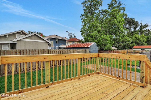 2578 Haldumar Ter, Jacksonville, FL 32204 - deck with a lawn, a fenced backyard, an outbuilding, and a storage shed
