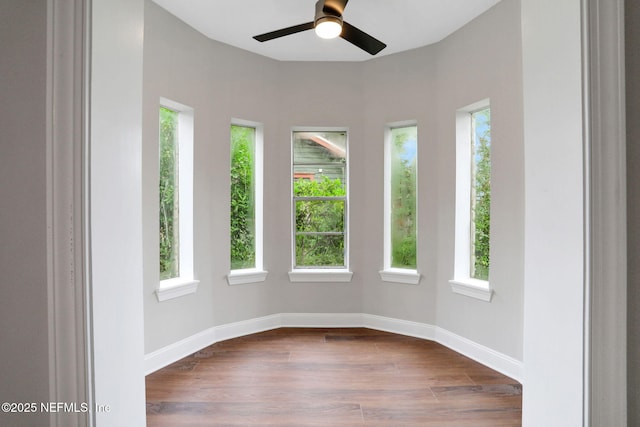 2578 Haldumar Ter, Jacksonville, FL 32204 - unfurnished room with baseboards, dark wood finished floors, and a healthy amount of sunlight