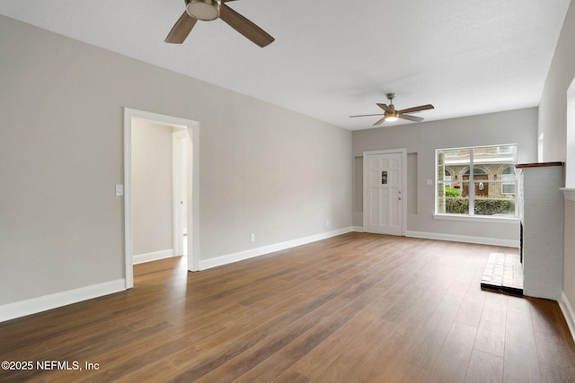 2578 Haldumar Ter, Jacksonville, FL 32204 - unfurnished living room featuring baseboards, a ceiling fan, and wood finished floors