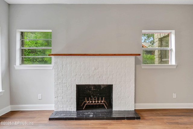 2578 Haldumar Ter, Jacksonville, FL 32204 - details with a brick fireplace, baseboards, and wood finished floors