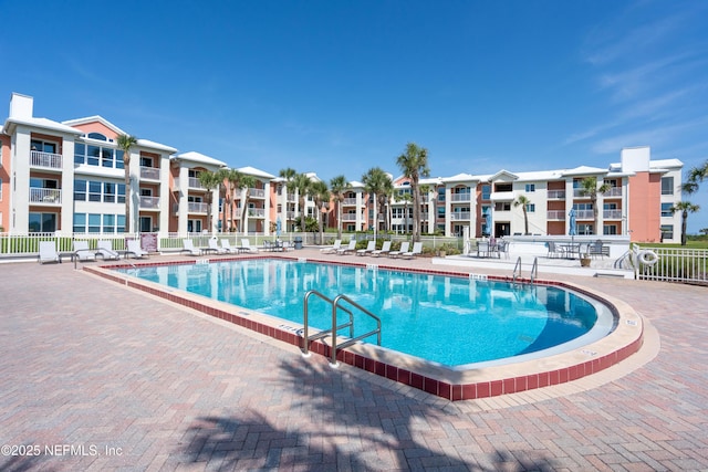 pool featuring a patio and fence