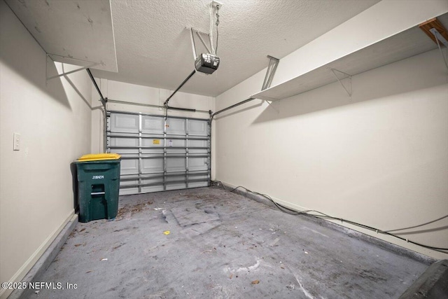garage with baseboards and a garage door opener