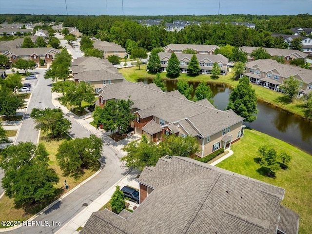 birds eye view of property with a water view and a residential view