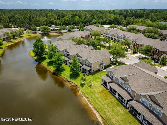 bird's eye view with a water view, a residential view, and a forest view