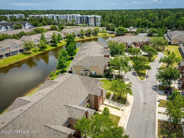 bird's eye view featuring a water view and a residential view
