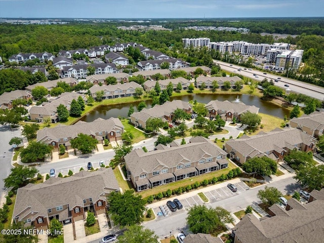 bird's eye view with a water view and a residential view