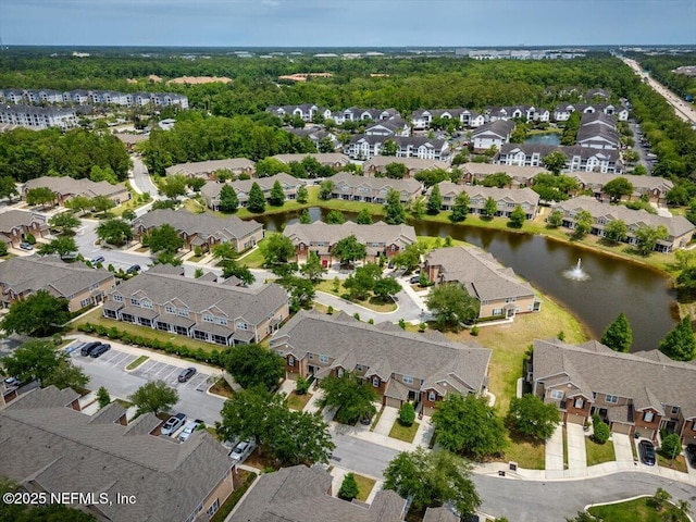 birds eye view of property with a residential view and a water view