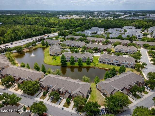 birds eye view of property featuring a water view and a residential view