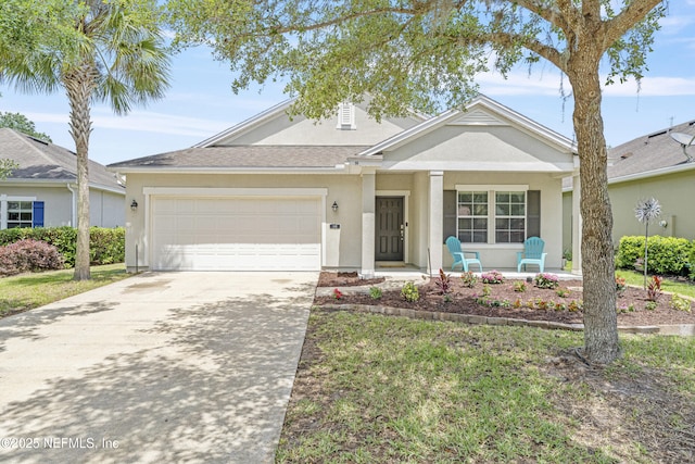 ranch-style home with covered porch, an attached garage, driveway, and stucco siding