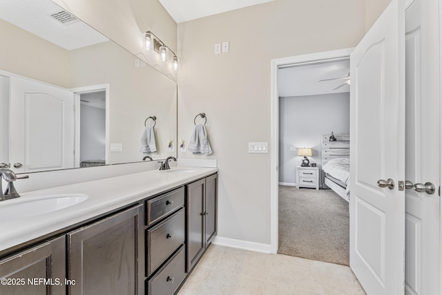 ensuite bathroom with visible vents, a sink, ensuite bathroom, and double vanity