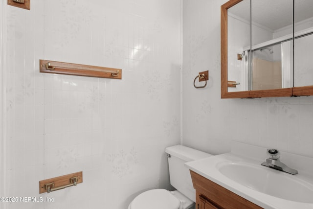 full bathroom with an enclosed shower, toilet, and vanity