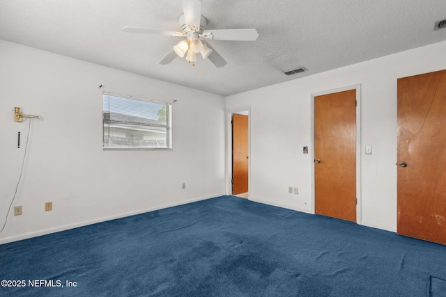 unfurnished bedroom with visible vents, carpet flooring, baseboards, and ceiling fan