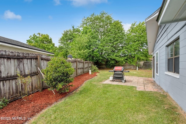 view of yard featuring a fenced backyard and a patio