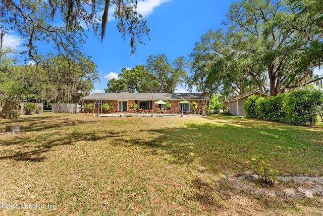 127 Old Jennings Rd, Orange Park, FL 32065 - single story home with fence, brick siding, and a front yard