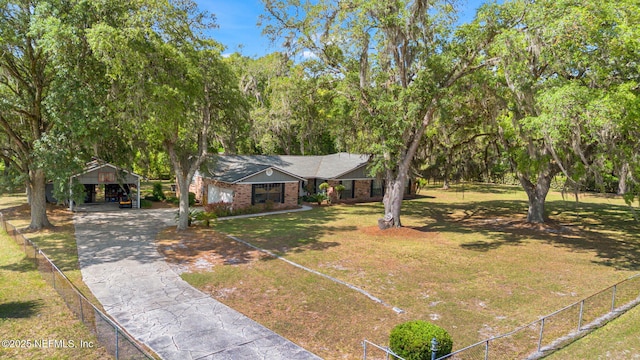 127 Old Jennings Rd, Orange Park, FL 32065 - view of front of home with fence, brick siding, a front lawn, and aphalt driveway