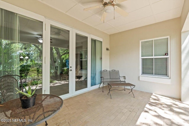 view of patio / terrace featuring ceiling fan and french doors