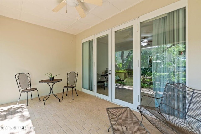 exterior space featuring french doors and a ceiling fan