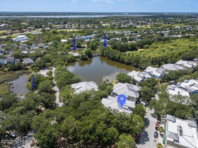 drone / aerial view featuring a water view and a residential view