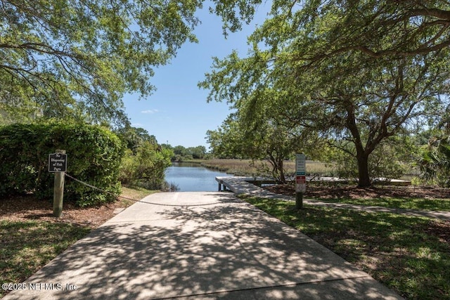 surrounding community with a water view