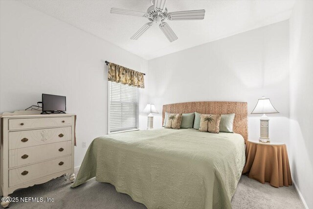 bedroom with baseboards, a ceiling fan, and carpet flooring