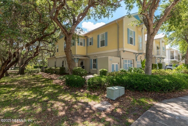 view of side of home with stucco siding