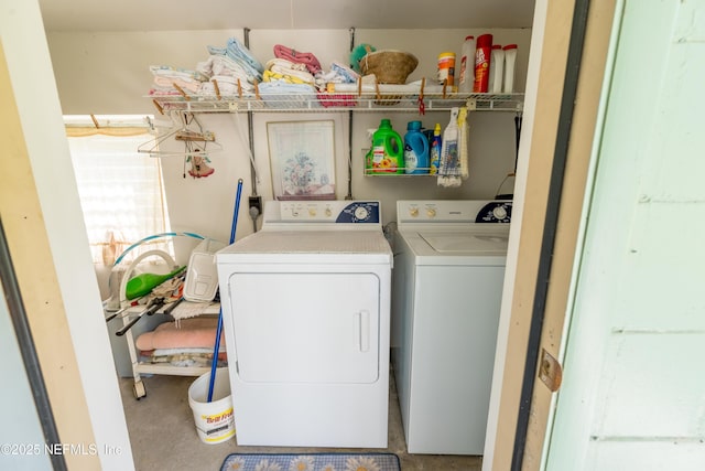 laundry area featuring separate washer and dryer and laundry area