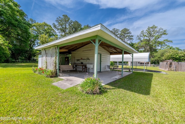 exterior space with fence and a patio area