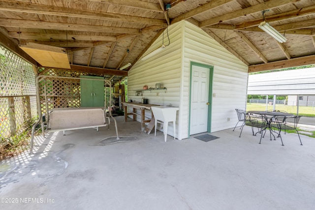view of patio / terrace with a sink and outdoor dining space