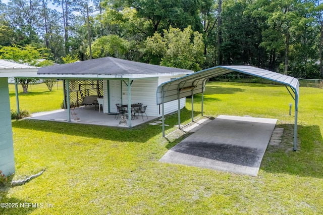 view of vehicle parking with a detached carport
