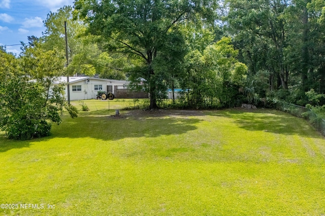 view of yard featuring fence