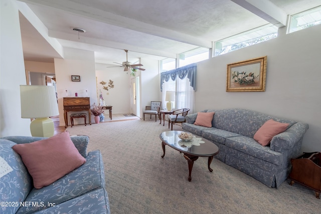 carpeted living room featuring a ceiling fan, beamed ceiling, and a healthy amount of sunlight