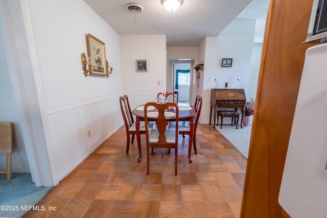 dining room featuring visible vents