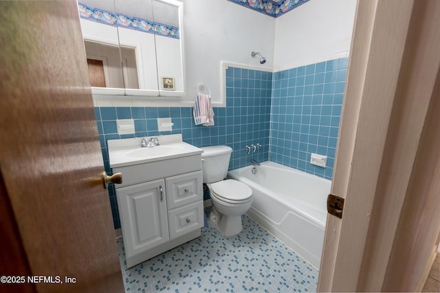 full bathroom featuring shower / bath combination, vanity, toilet, and tile walls