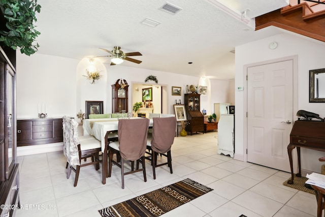 dining area with light tile patterned floors, ceiling fan, and visible vents