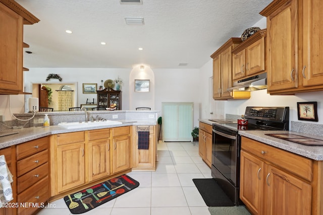 kitchen featuring under cabinet range hood, light tile patterned floors, a sink, and black / electric stove