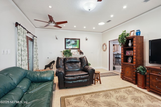 tiled living area with visible vents, ornamental molding, baseboards, ceiling fan, and recessed lighting