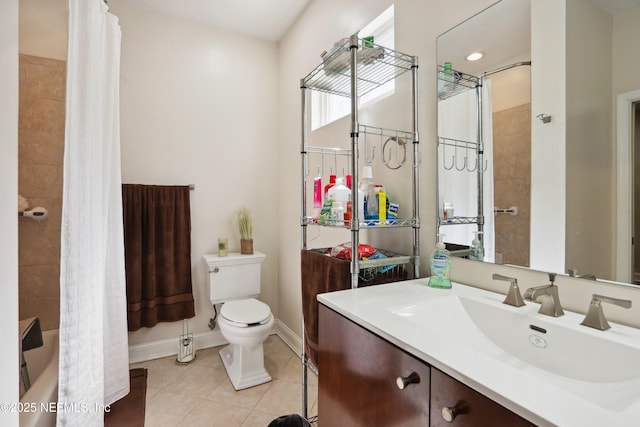 bathroom with vanity, shower / bath combination with curtain, toilet, baseboards, and tile patterned floors