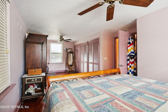 bedroom with baseboards, a textured ceiling, and ceiling fan