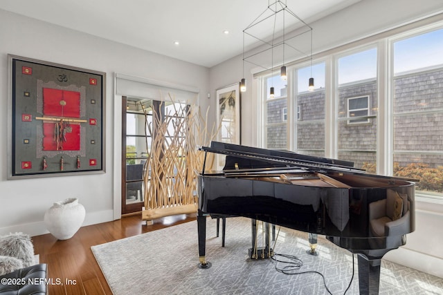 sitting room featuring recessed lighting, baseboards, plenty of natural light, and wood finished floors