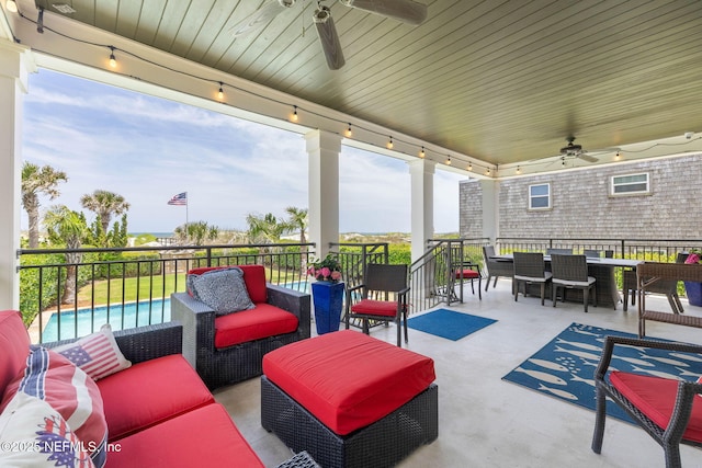 view of patio / terrace with an outdoor living space, a ceiling fan, and outdoor dining space